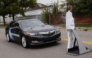 An Acura RLX sedan brakes to avoid a mannequin "pedestrian" during Honda's Omni Directional V2X demonstration at the ITS World Congress in Detroit, Michigan September 10, 2014. REUTERS/Rebecca Cook